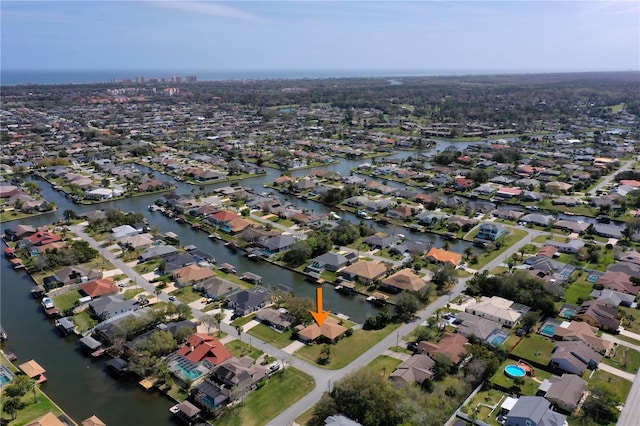 aerial view featuring a water view and a residential view