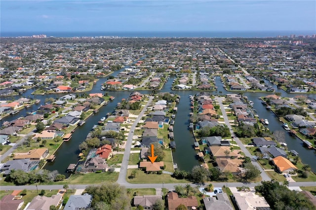 aerial view featuring a water view and a residential view