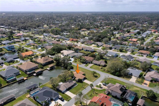 bird's eye view with a residential view and a water view