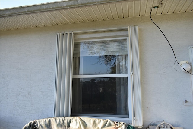 details featuring stucco siding