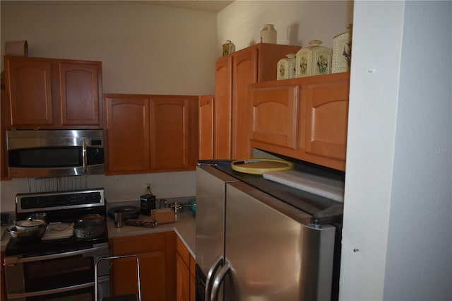 kitchen featuring light countertops and appliances with stainless steel finishes