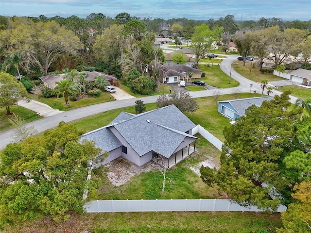 birds eye view of property with a residential view