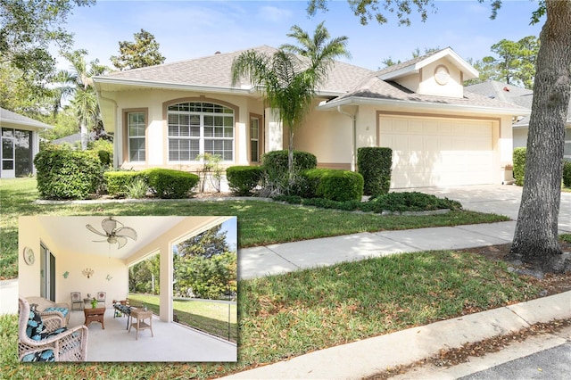 ranch-style home featuring stucco siding, concrete driveway, a front yard, a garage, and an outdoor living space