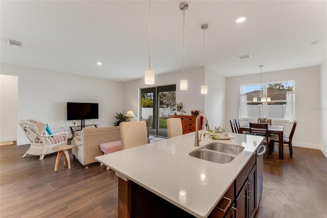 kitchen with a healthy amount of sunlight, stainless steel dishwasher, visible vents, and a sink