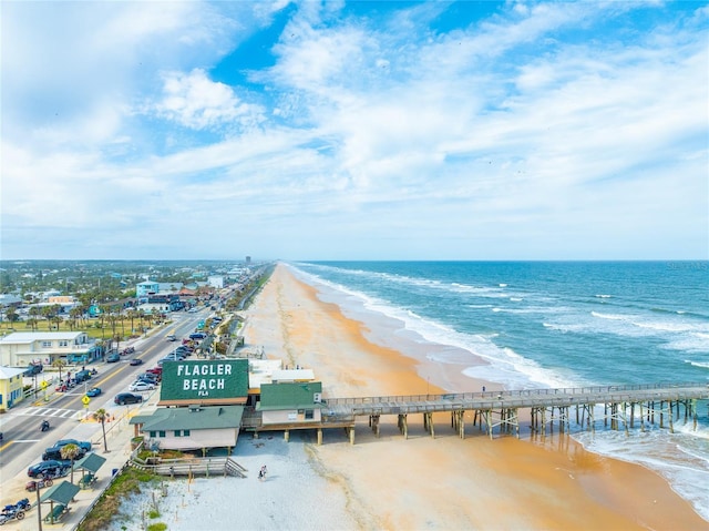 birds eye view of property featuring a view of the beach and a water view