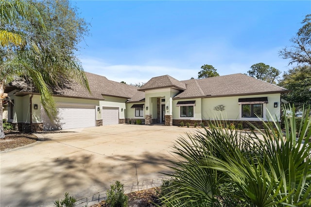 view of front facade featuring an attached garage, concrete driveway, stone siding, roof with shingles, and stucco siding