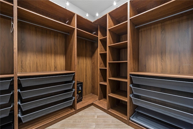 walk in closet featuring light wood-type flooring