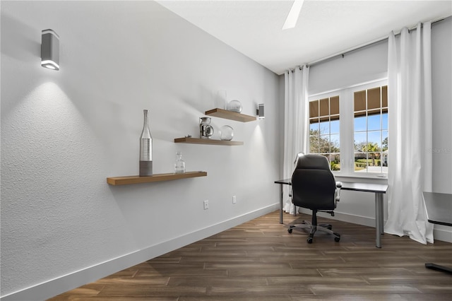 home office with baseboards and wood finished floors