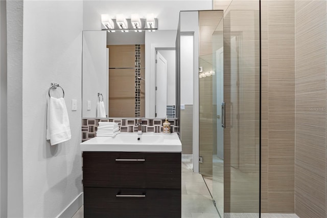 full bath featuring a shower stall, backsplash, and vanity