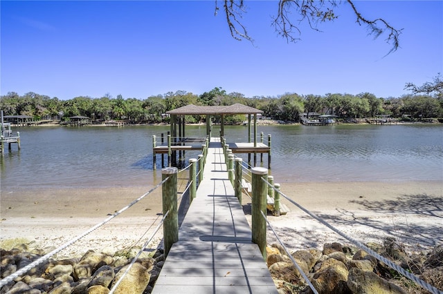 view of dock with a water view