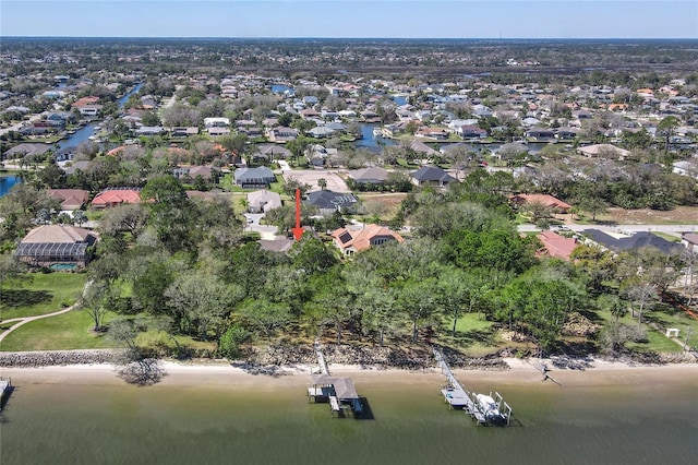 drone / aerial view with a water view and a residential view