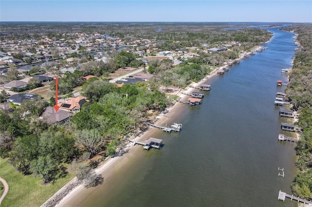 drone / aerial view with a water view and a residential view