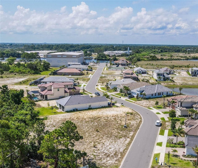 bird's eye view featuring a residential view and a water view