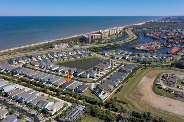 birds eye view of property with a residential view and a water view