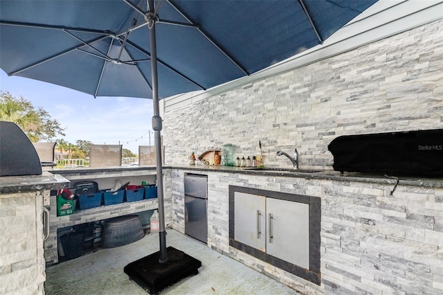 view of patio / terrace featuring a sink and area for grilling