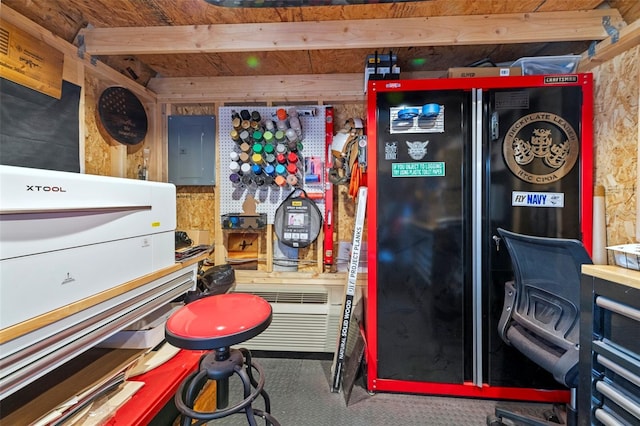 miscellaneous room with beam ceiling and electric panel