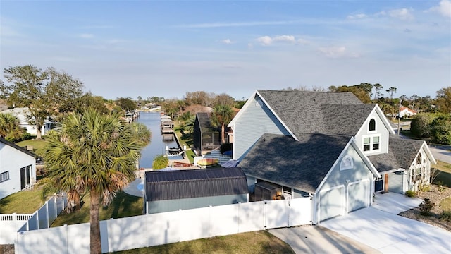 birds eye view of property with a water view