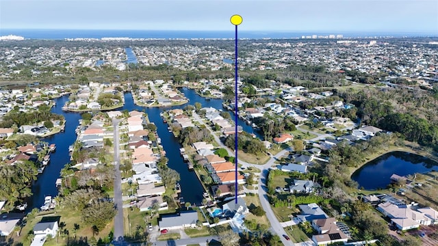 aerial view featuring a water view and a residential view