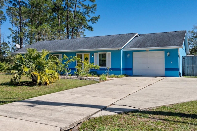 single story home with stucco siding, an attached garage, fence, driveway, and a front lawn