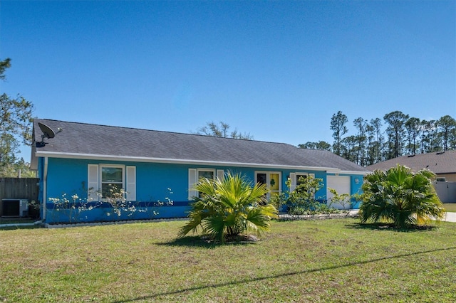 single story home featuring stucco siding, a front yard, fence, a garage, and cooling unit