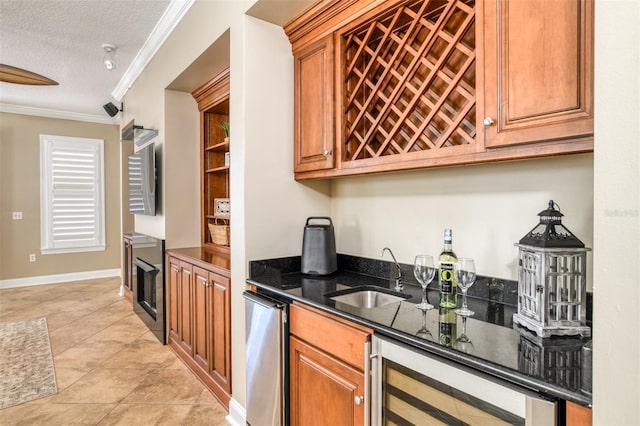 bar with beverage cooler, ornamental molding, indoor wet bar, a textured ceiling, and a sink