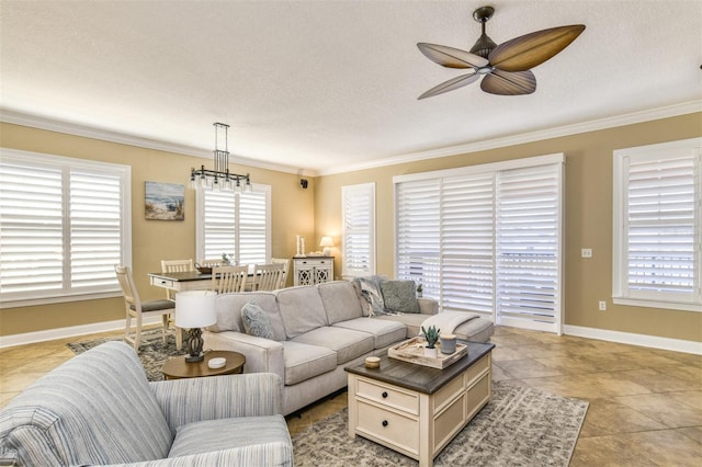 living room with a wealth of natural light, crown molding, and baseboards