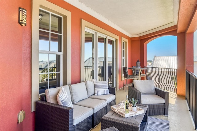 balcony featuring a sunroom and an outdoor hangout area