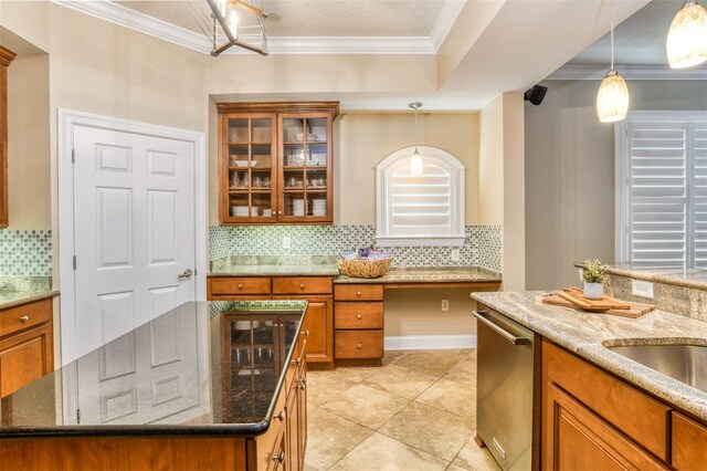 kitchen featuring crown molding, stainless steel dishwasher, and brown cabinets