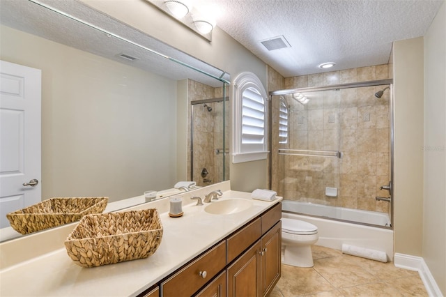 bathroom featuring visible vents, toilet, tile patterned floors, a textured ceiling, and vanity