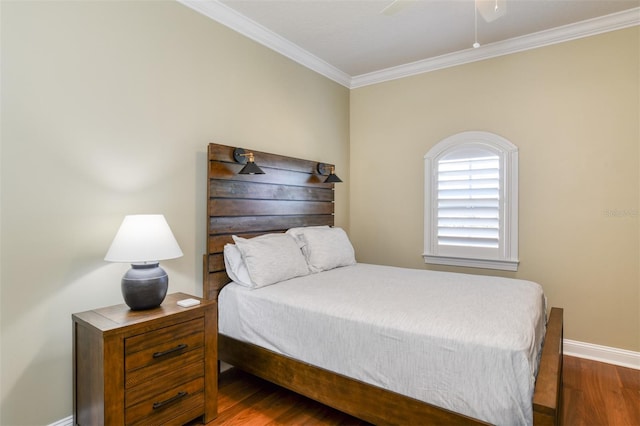 bedroom with dark wood-style floors, ceiling fan, baseboards, and ornamental molding