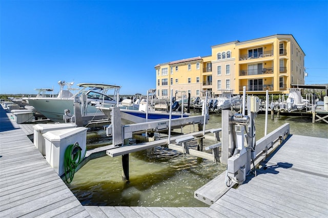 view of dock with a water view and boat lift