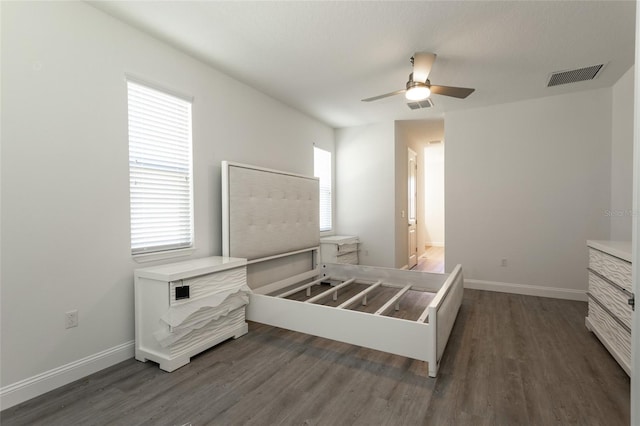 6 Zamia Pl, Palm Coast, FL 32164 - unfurnished bedroom with multiple windows, wood finished floors, visible vents, and baseboards