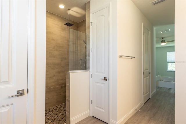 6 Zamia Pl, Palm Coast, FL 32164 - bathroom with visible vents, walk in shower, and wood finished floors