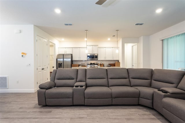 6 Zamia Pl, Palm Coast, FL 32164 - living room with recessed lighting, visible vents, and light wood-type flooring