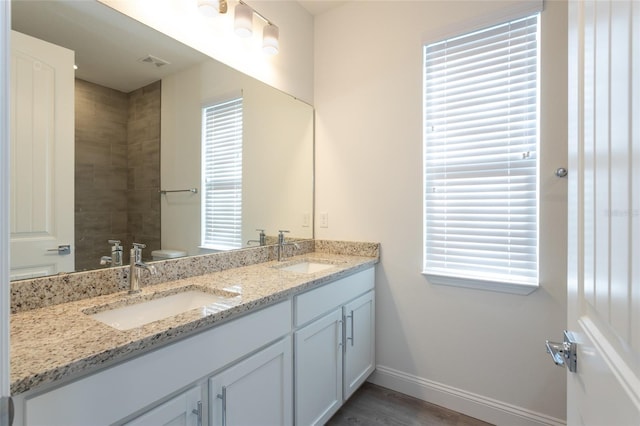 6 Zamia Pl, Palm Coast, FL 32164 - full bathroom featuring double vanity, visible vents, baseboards, and a sink