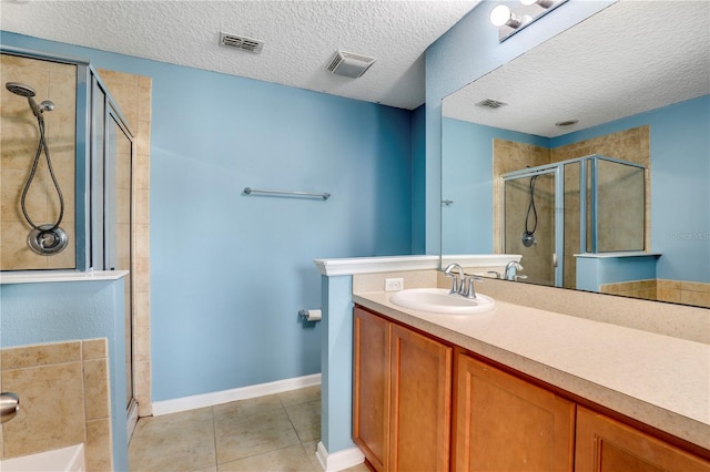 full bath with a stall shower, visible vents, and tile patterned floors