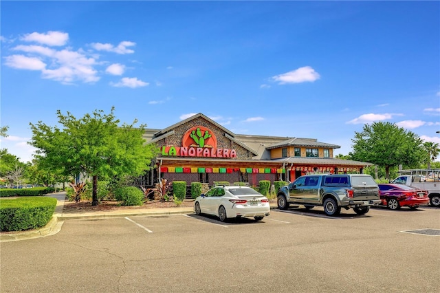 view of property with uncovered parking