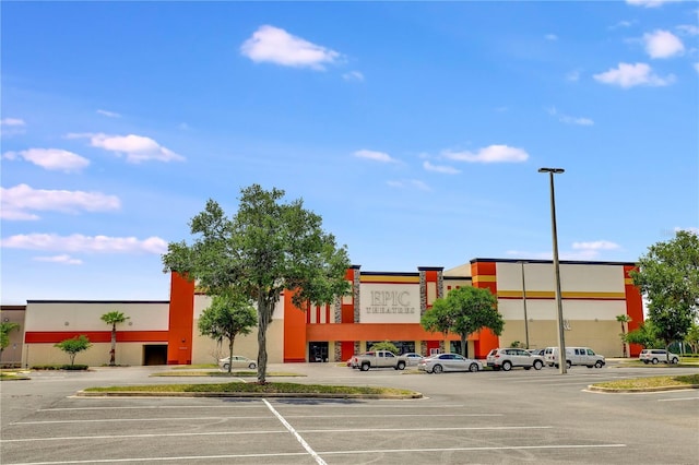 view of property featuring uncovered parking