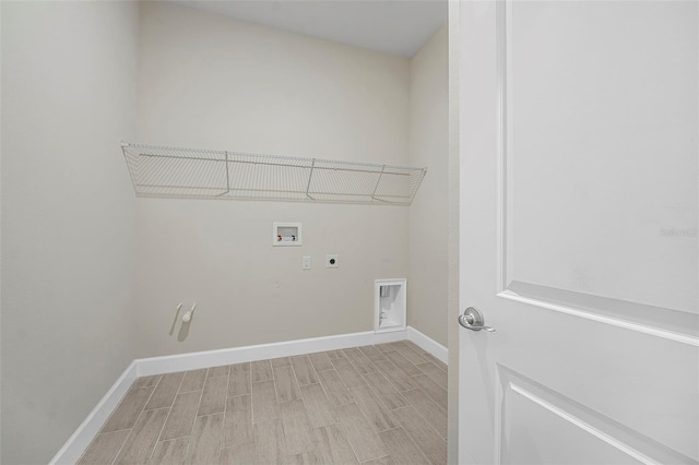 laundry room with laundry area, hookup for an electric dryer, baseboards, and washer hookup