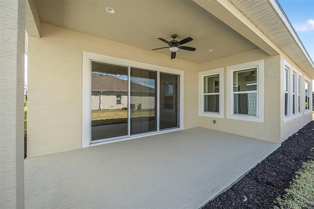 view of patio featuring ceiling fan