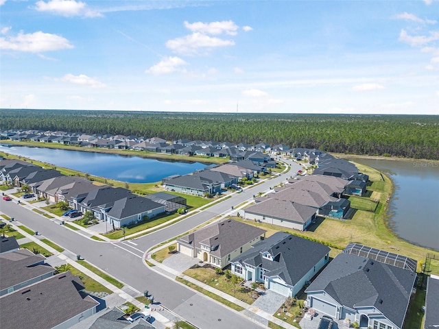 aerial view featuring a residential view and a water view