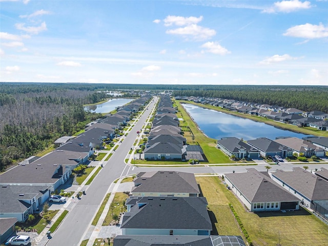 birds eye view of property with a residential view and a water view