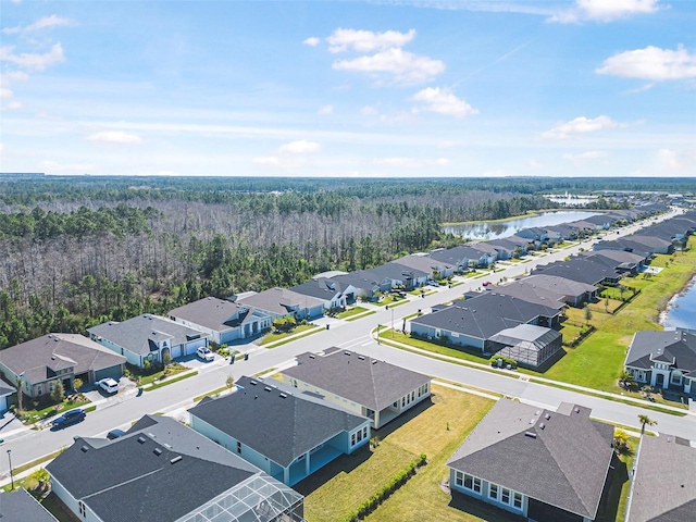 bird's eye view with a forest view, a residential view, and a water view