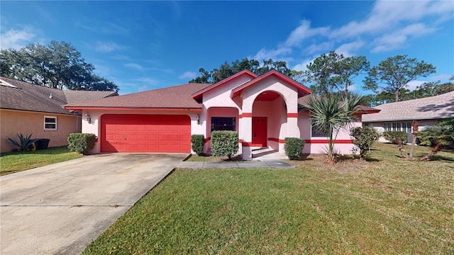 view of front of house featuring a front lawn, an attached garage, concrete driveway, and stucco siding