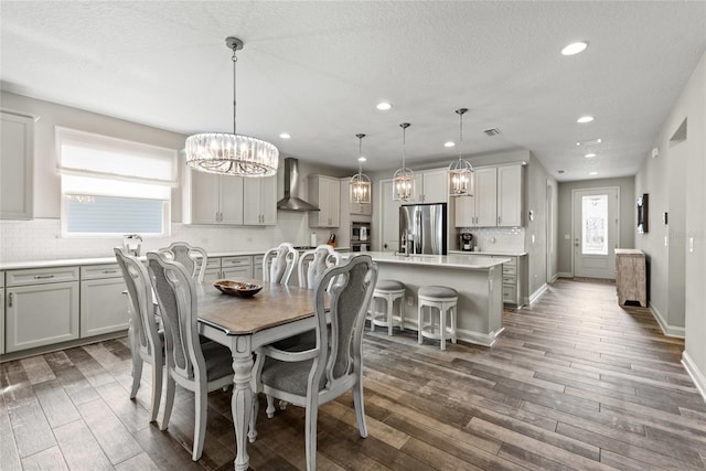 dining area featuring recessed lighting, visible vents, baseboards, and wood finished floors