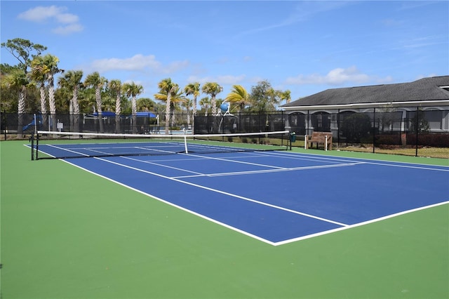 view of tennis court with fence