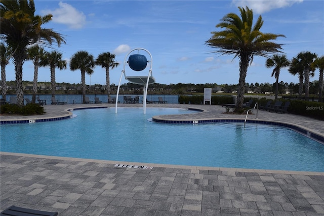 community pool featuring a patio area