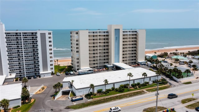 bird's eye view with a water view and a view of the beach