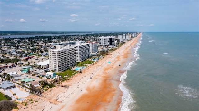 aerial view featuring a view of city, a water view, and a view of the beach