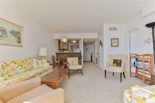 carpeted living room featuring visible vents